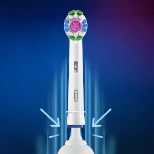 Close up of an Oral-B electric toothbrush head with arrows showing connection to the handle.
