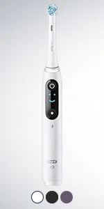 Oral-B iO toothbrush with a digital display showing a smiley face.