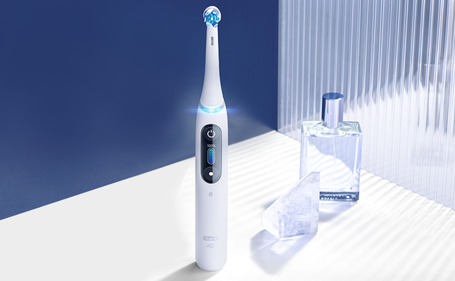 Oral-B iO electric toothbrush showing a fully charged battery and clean design.