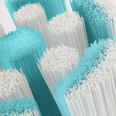Oral-B toothbrush head bristles, showing a close-up of the blue and white filaments.
