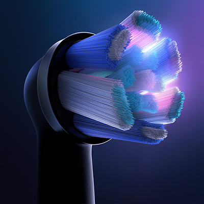 Oral-B brush head featuring multi-colored bristles for cleaning and polishing teeth.