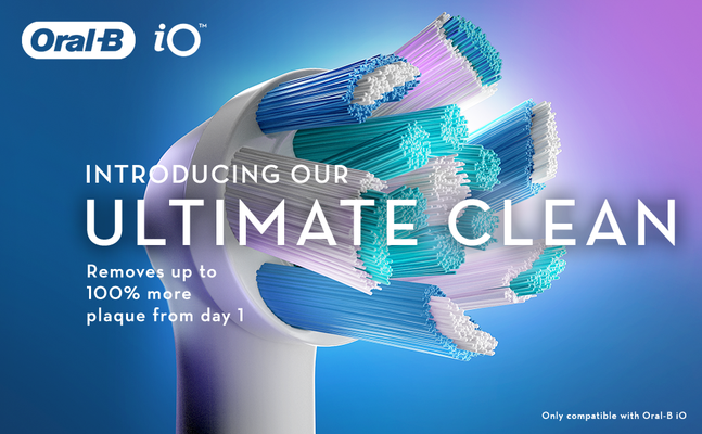 Close up of an Oral-B iO toothbrush head with multi-colored bristles introducing our ultimate clean removes up to 100% more plaque from day 1 only compatible with oral-b io.