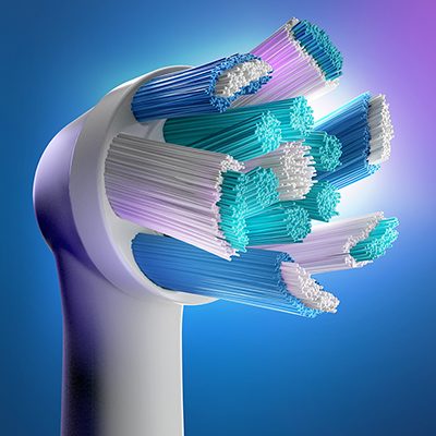 Oral-B brush head featuring multi-colored bristles in blue, teal, white, and purple.