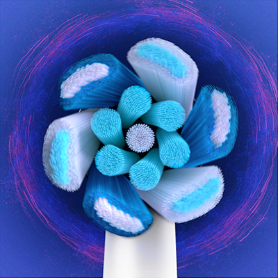 Oral-B brush head close-up showing different bristle types and patterns for cleaning.