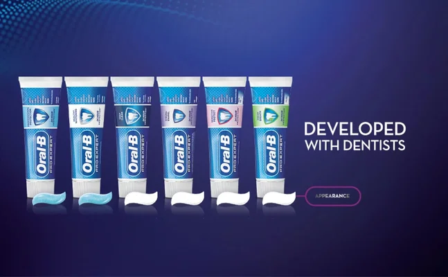 Six tubes of Oral-B Pro-Expert toothpaste are shown with swatches of paste and the text DEVELOPED WITH DENTISTS and APPEARANCE.