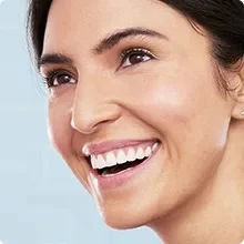 Close-up of a woman smiling.