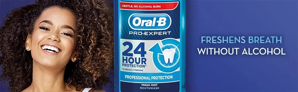 A smiling woman and an Oral-B mouthwash bottle next to the text FRESHENS BREATH WITHOUT ALCOHOL.
