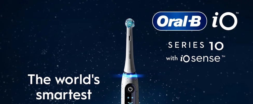 Close-up of a woman with an Oral-B iO Series 2 electric toothbrush, designed for an easy switch to electric.