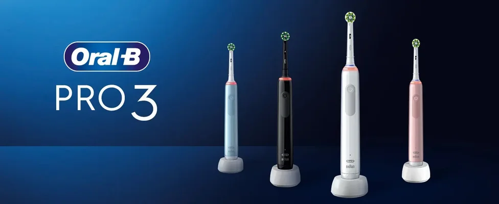 Four Oral-B PRO 3 electric toothbrushes in light blue, black, white, and pink on charging stands with the text Oral-B PRO 3.