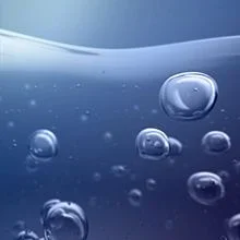 Bubbles rising in blue water.