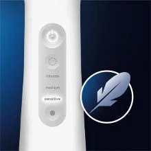 White device control panel showing power button, indicator lights, and the text intense, medium, sensitive, next to a feather icon.