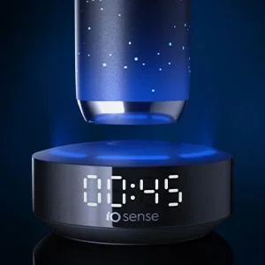 Oral-B iO Sense toothbrush handle charging on its base, which displays the brushing time.
