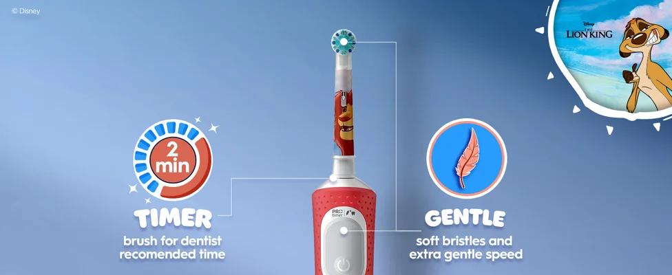 A close-up of an Oral-B electric toothbrush with a Disney Lion King design. Text highlights features: a 2-minute timer for dentist-recommended brushing time, and gentle soft bristles with extra gentle speed. Timon from The Lion King is shown in the corner.