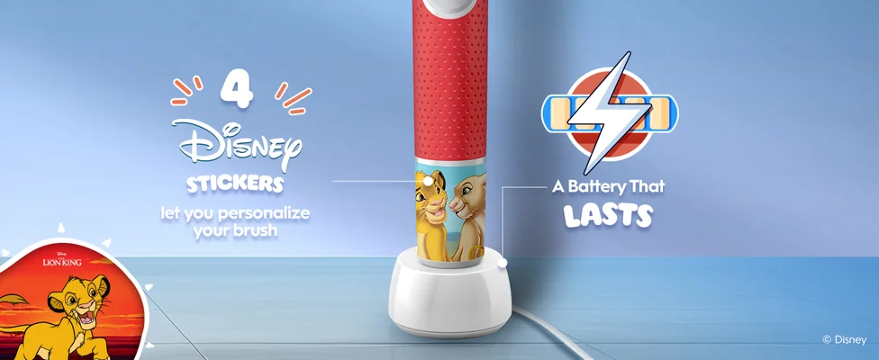 The bottom half of an Oral-B electric toothbrush with Disney Lion King characters Simba and Nala on the handle. Text highlights “4 Disney Stickers let you personalize your brush” and “A Battery That Lasts”. A battery icon and a sticker image are displayed.
