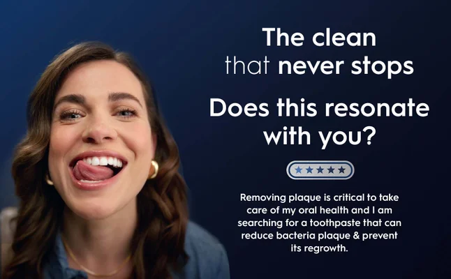 A smiling woman is sticking out her tongue, highlighting her clean teeth, with text that reads The clean that never stops, Does this resonate with you? and a message about removing plaque for oral health.