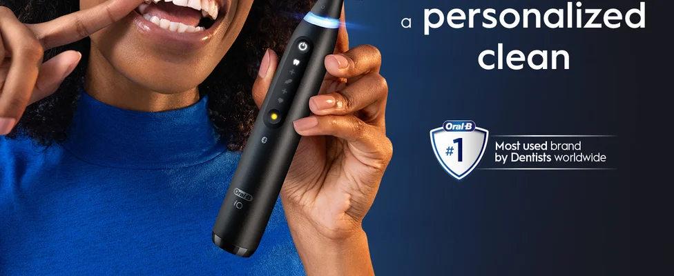 Smiling person with Oral-B toothbrush featuring