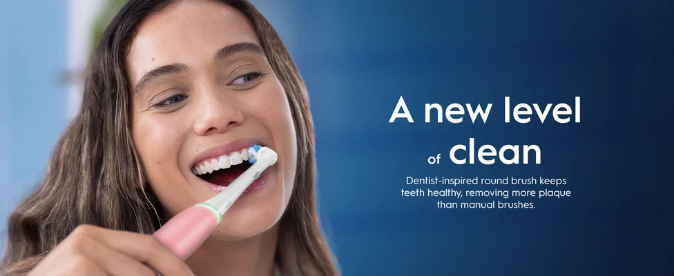 Person using electric toothbrush with text about dentist-inspired round brush for better cleaning