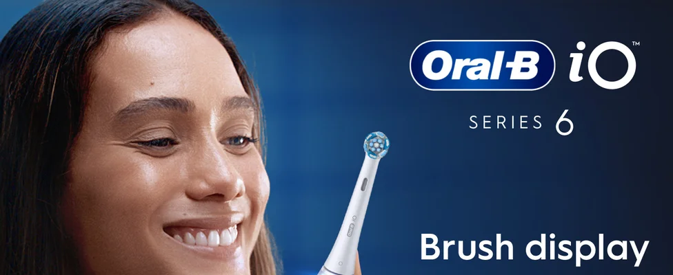 An Oral-B iO Series 6 electric toothbrush with the brush display feature on a blue background