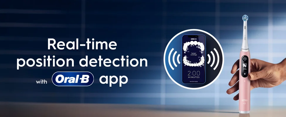An Oral-B toothbrush with a close-up on the app showing real-time brushing tracking technology