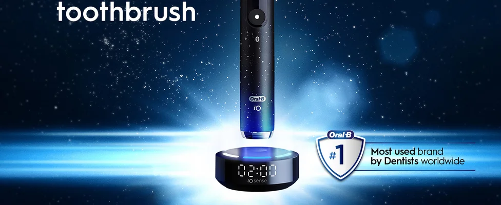 Oral-B electric toothbrush with charging base on blue background, #1 dentist brand badge.