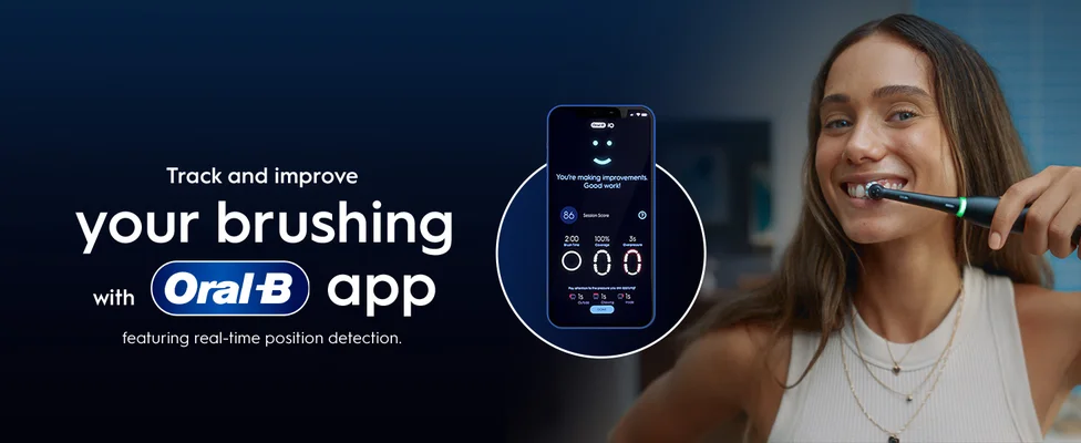 A woman brushes her teeth with a close-up on the Oral-B app brushing feature