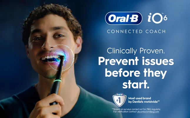 Person using Oral-B iO6 electric toothbrush with text 'Prevent issues before they start
