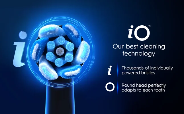 Blue illuminated iO toothbrush head showcasing advanced cleaning technology.