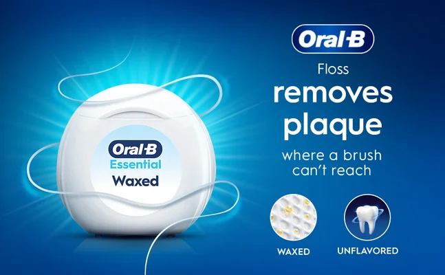 Oral-B Essential Waxed floss container with text: removes plaque where a brush can't reach.
