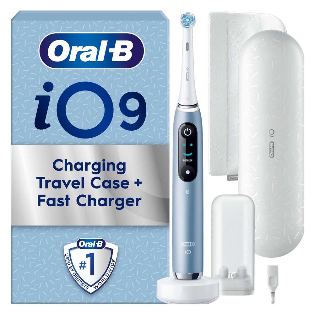 Oral-B iO9 electric toothbrush shown with charging travel case and fast charger, as well as the charging base.