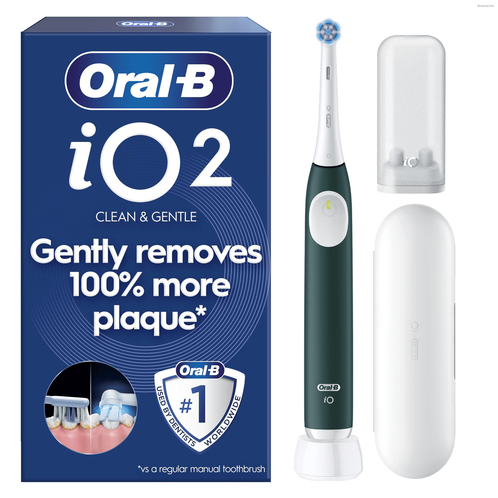 Oral-B iO2 electric toothbrush in dark green, shown with its packaging highlighting Gently removes 100% more plaque*.