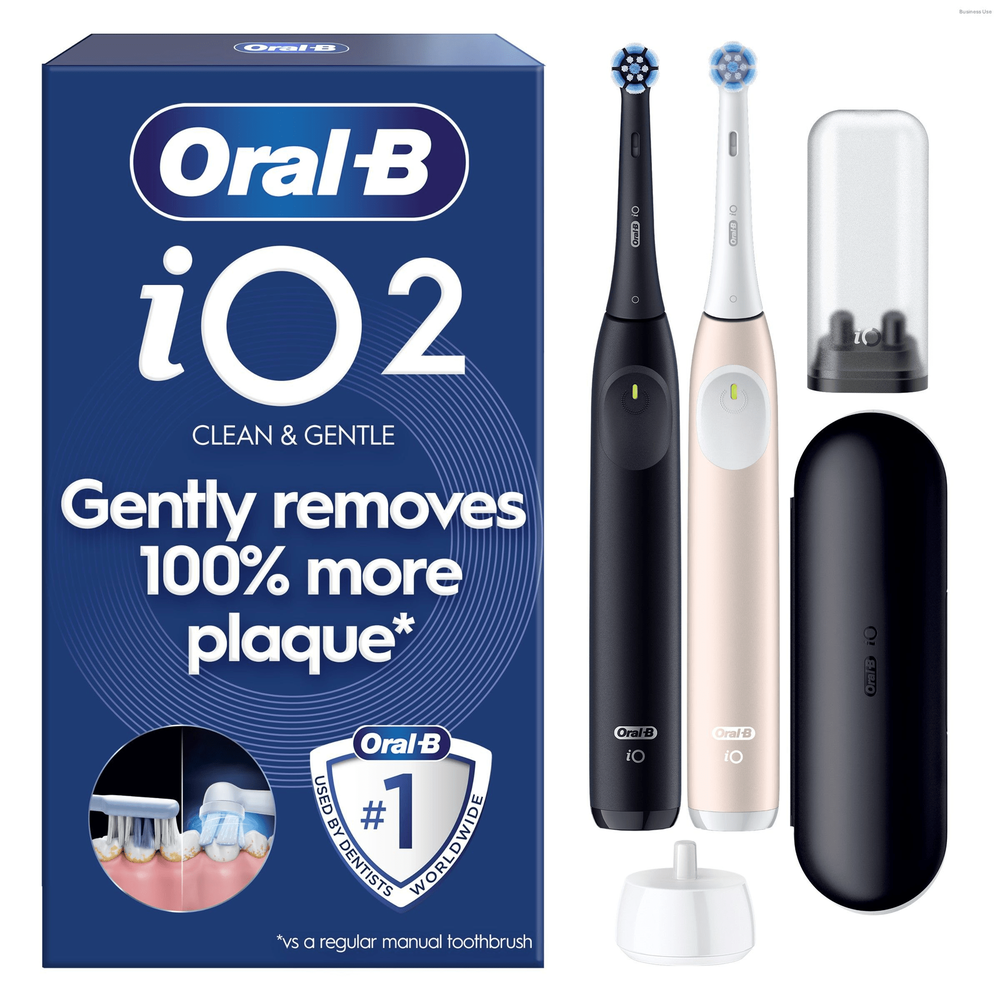 Oral-B iO2 electric toothbrush twin pack, highlighting its claim of gently removing 100% more plaque.