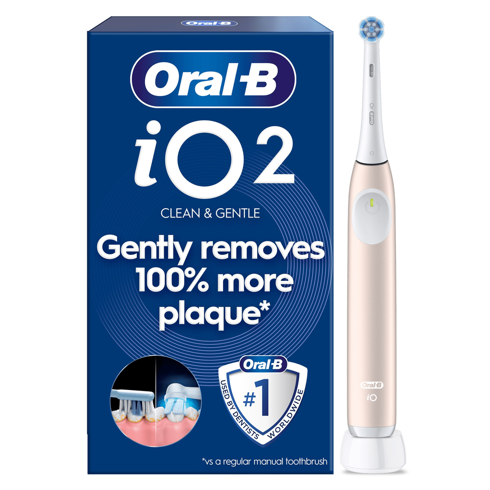 Oral-B iO2 electric toothbrush with packaging, highlighting the claim of gently removing 100% more plaque.