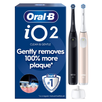 Oral-B iO2 electric toothbrush with travel case & packaging, highlights Gently removes 100% more plaque*.