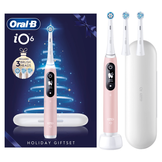 Oral-B iO6 toothbrush holiday giftset in pink, highlighting that it includes 3 brush heads and a travel case.